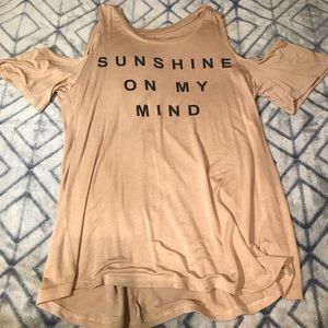 Cute graphic tunic with shoulder cut outs.